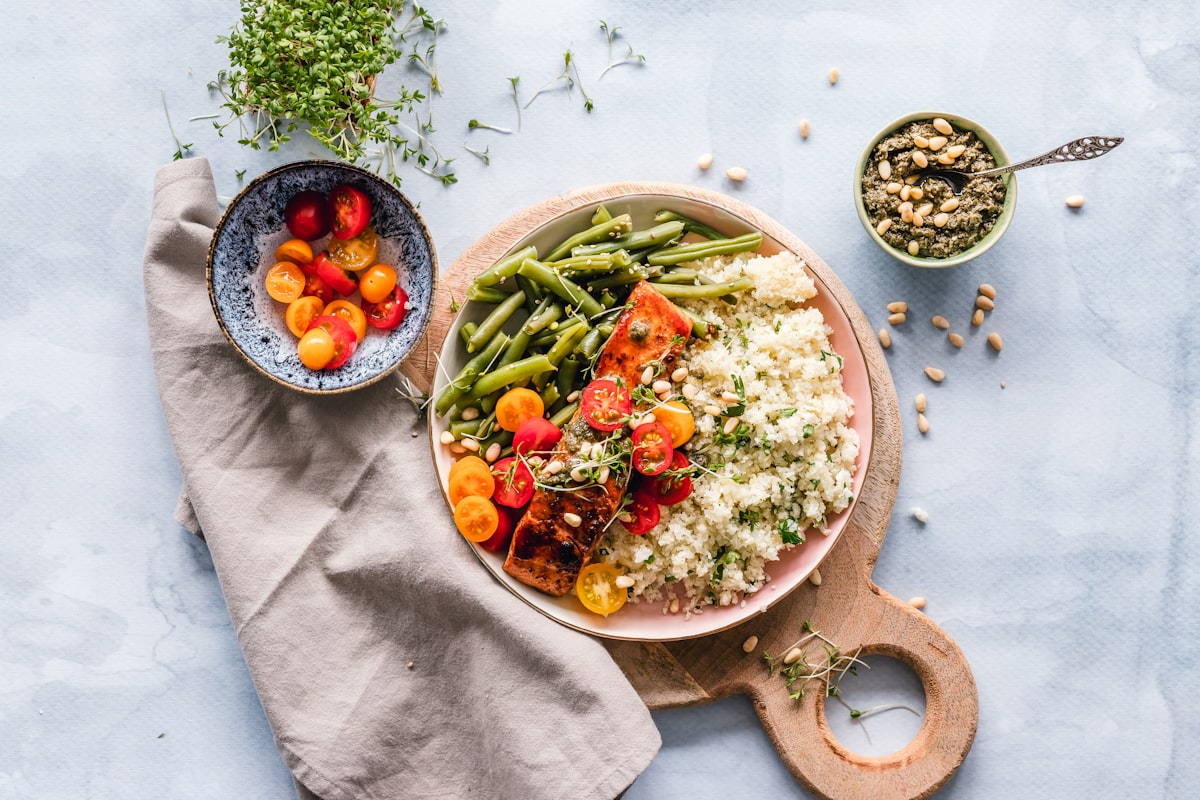 Plant-based cooking demonstration with fresh vegetables and whole grains